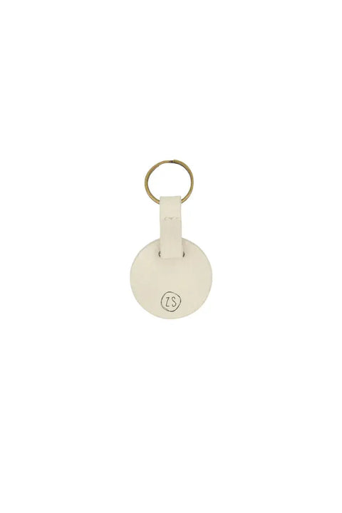 Ronde sleutelhanger geniet ecru