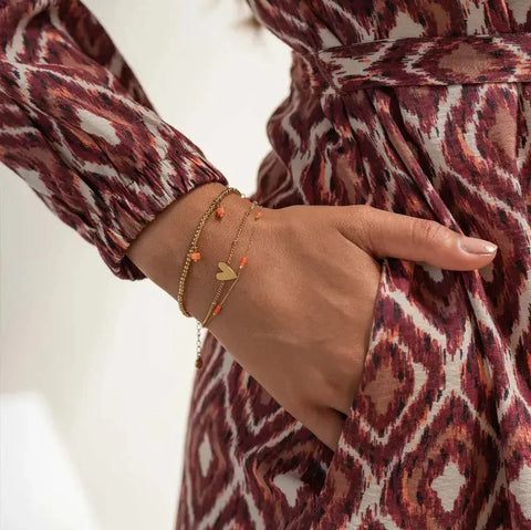 Kralenarmbandje met blokjes koraalroze / goud